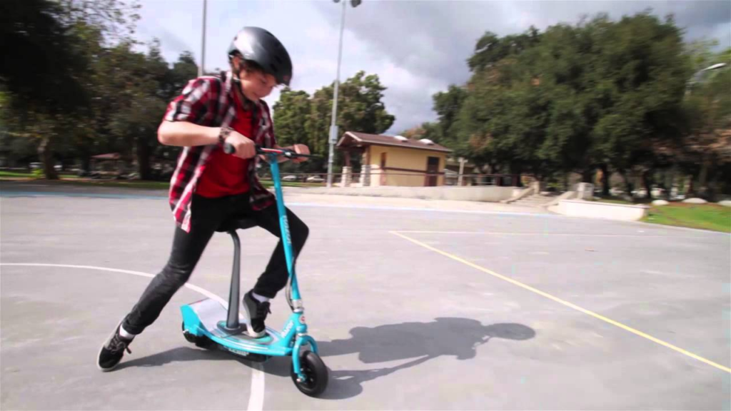 child riding a Razor E200 Electric Scooter