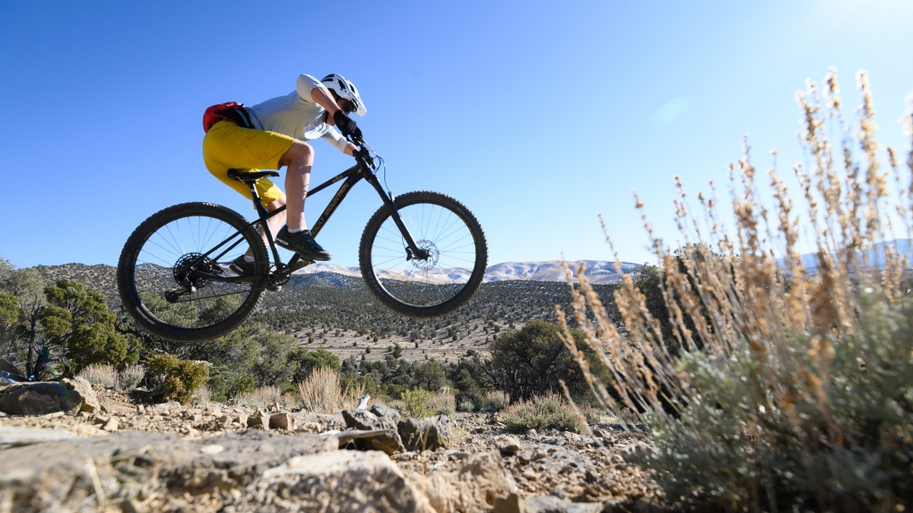 A Man Riding Rocky Mountain Slayer 2024 Mountain Bike